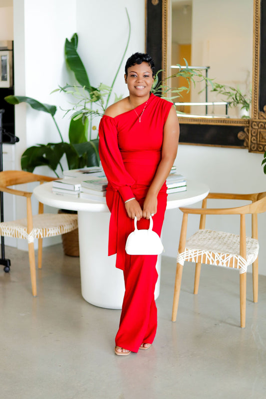 Ref classy jumpsuit for women paired with white handbag and light accessories for evening and parties